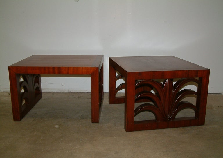 A fine pair of custom walnut end tables designed by T. H. Robsjohn Gibbings for Widdicomb with deeply carved palm leaves.  The top is a richly grained walnut veneer set in a rectangular two inch border.  A partial manufacturer's decal is applied to